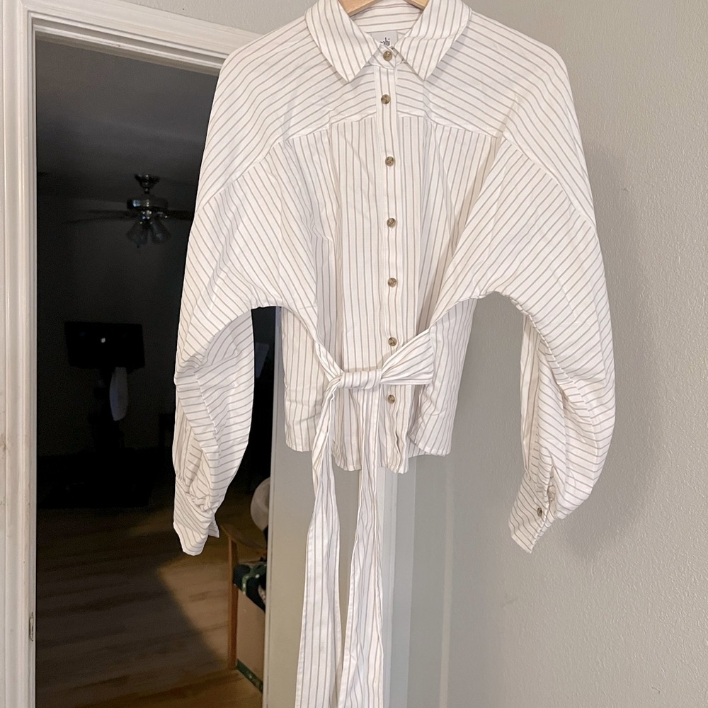 Off white, gray stripped blouse with a wrap tie